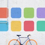 wellness logo above bicycle
