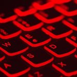 Red Backlit Keyboard - Stay alert for scams
