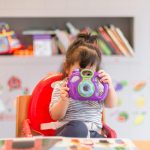 Toddler with camera