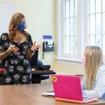 Instructor teaching student