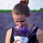 Woman smelling flowers