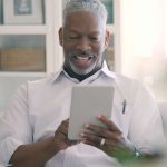 man with an ipad